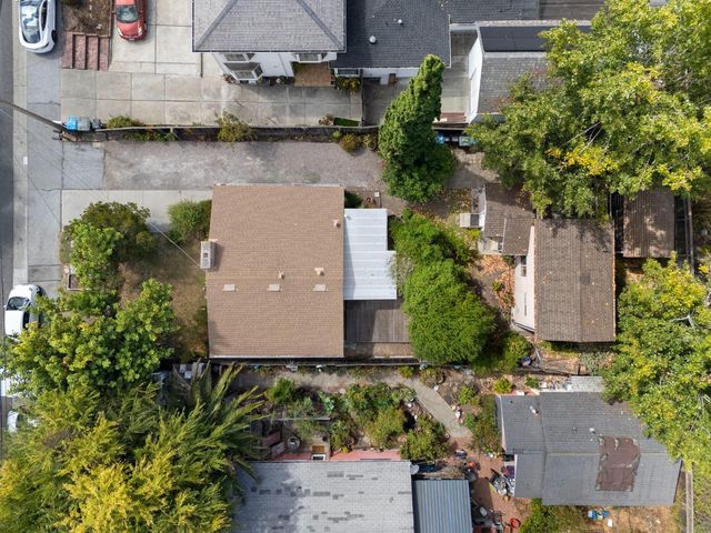 an aerial view of a house with a garden