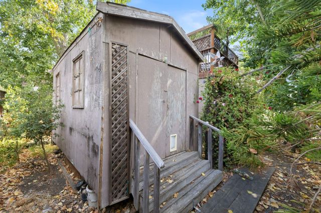 an aerial view of residential building and trees
