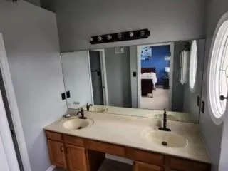 a bathroom with a sink and a mirror