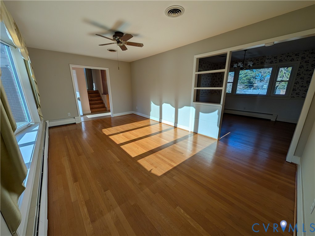 8216 Ireton Road Henrico, VA 23228 - Photo 8 of 16 wooden floor in an empty room with a window