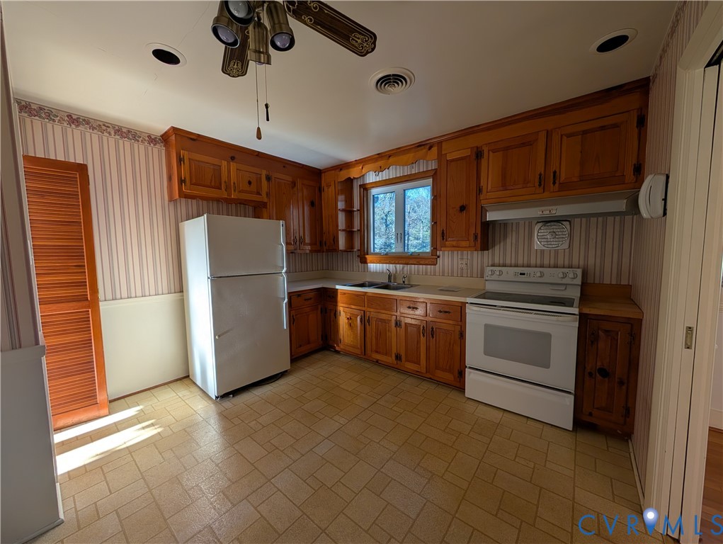 8216 Ireton Road Henrico, VA 23228 - Photo 9 of 16 a kitchen with stainless steel appliances a refrigerator sink and cabinets