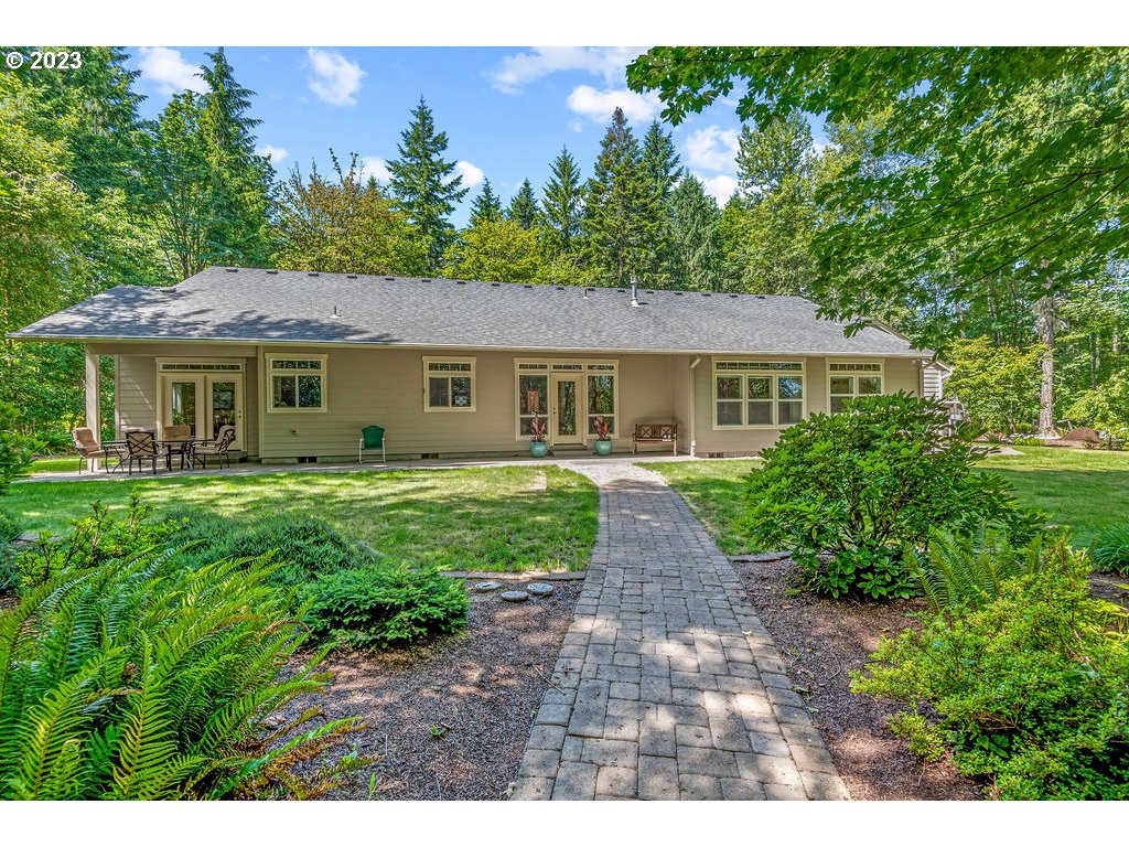 153 Cornell Road Toutle, WA 98649 - Photo 27 of 35 a front view of a house with a garden