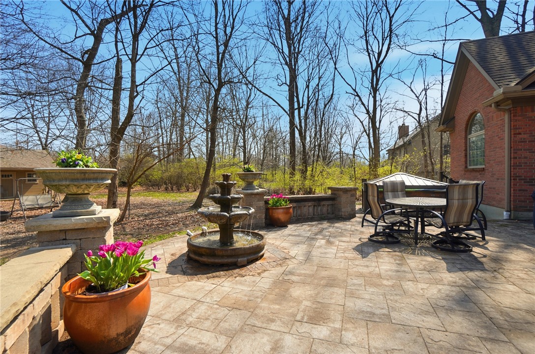 472 Timber Walk Court Springboro, OH 45066 - Photo 69 of 86 This tranquil outdoor area provides an idyllic setting for relaxation and entertainment.