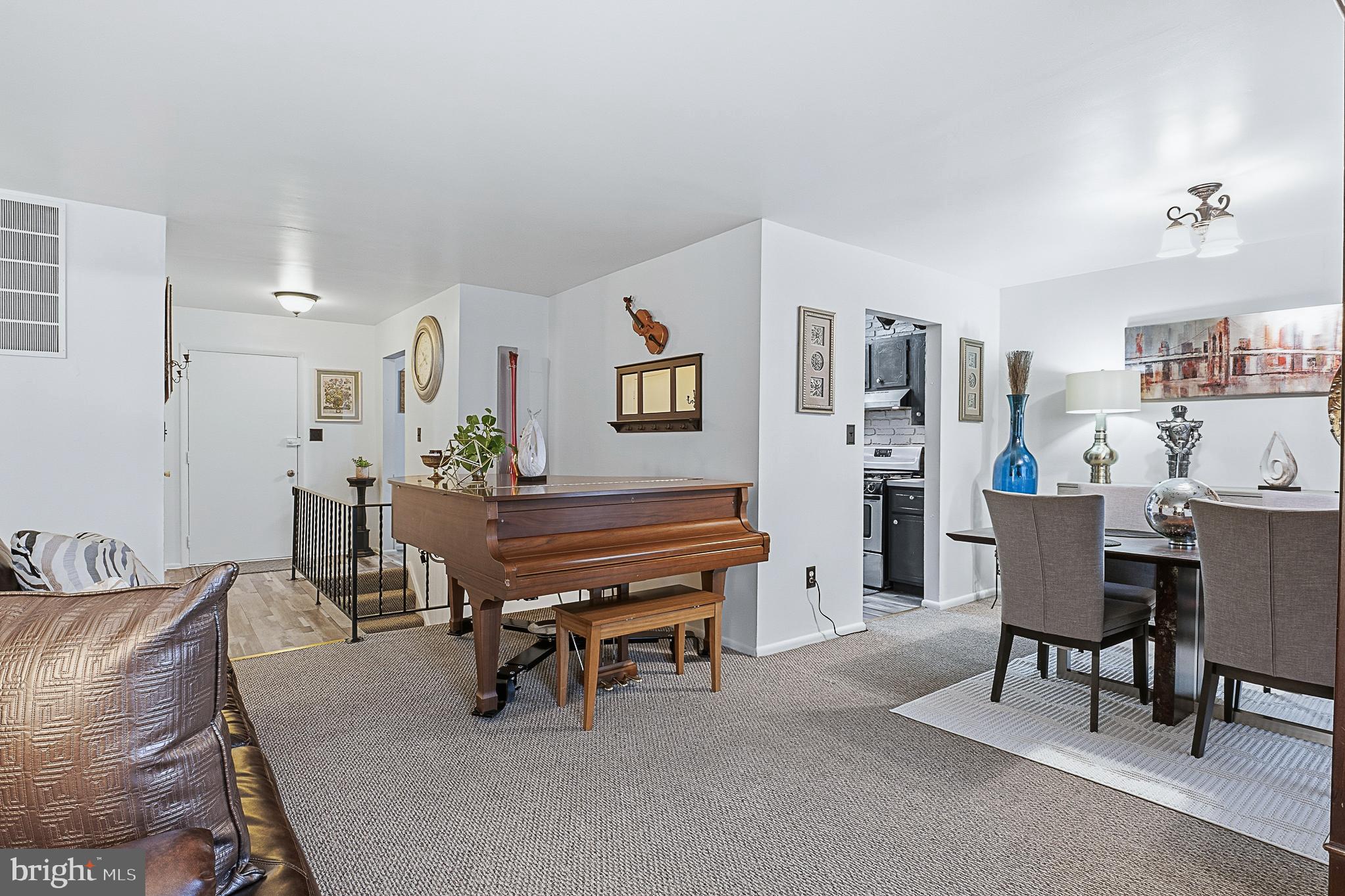 4542 Kinmount Road Lanham, MD 20706 - Photo 11 of 70 a living room with furniture and a piano