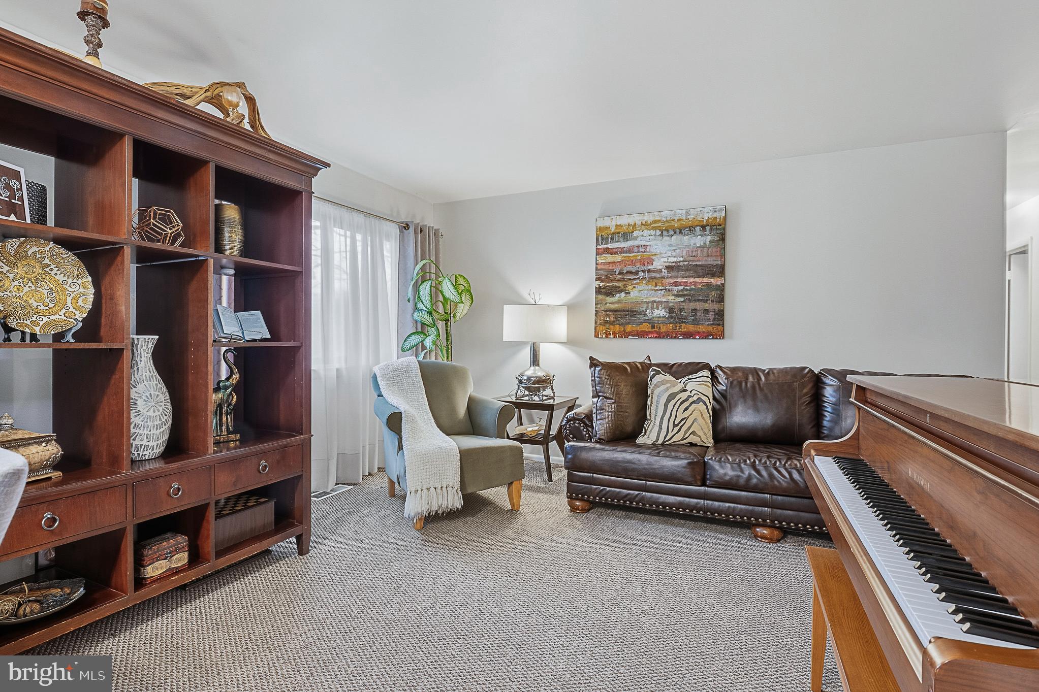 4542 Kinmount Road Lanham, MD 20706 - Photo 12 of 70 a living room with furniture and a piano