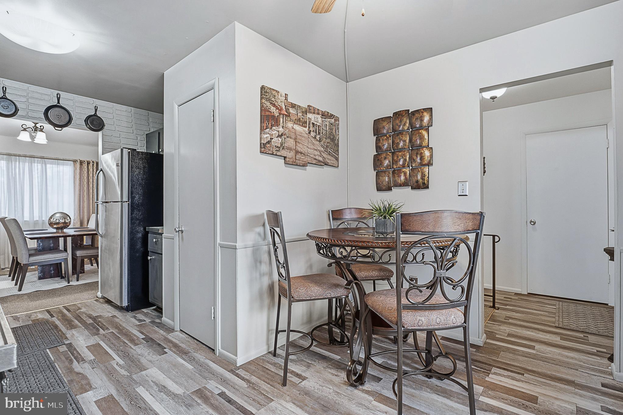 4542 Kinmount Road Lanham, MD 20706 - Photo 23 of 70 a view of a dining room with furniture window and wooden floor