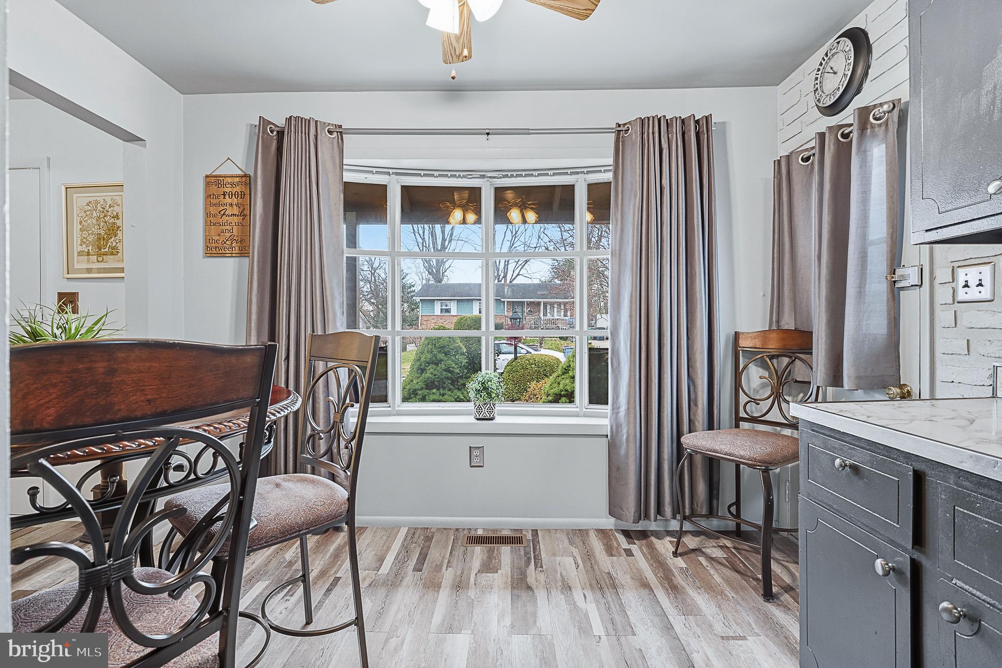 4542 Kinmount Road Lanham, MD 20706 - Photo 24 of 70 a view of a dining room with furniture window and wooden floor