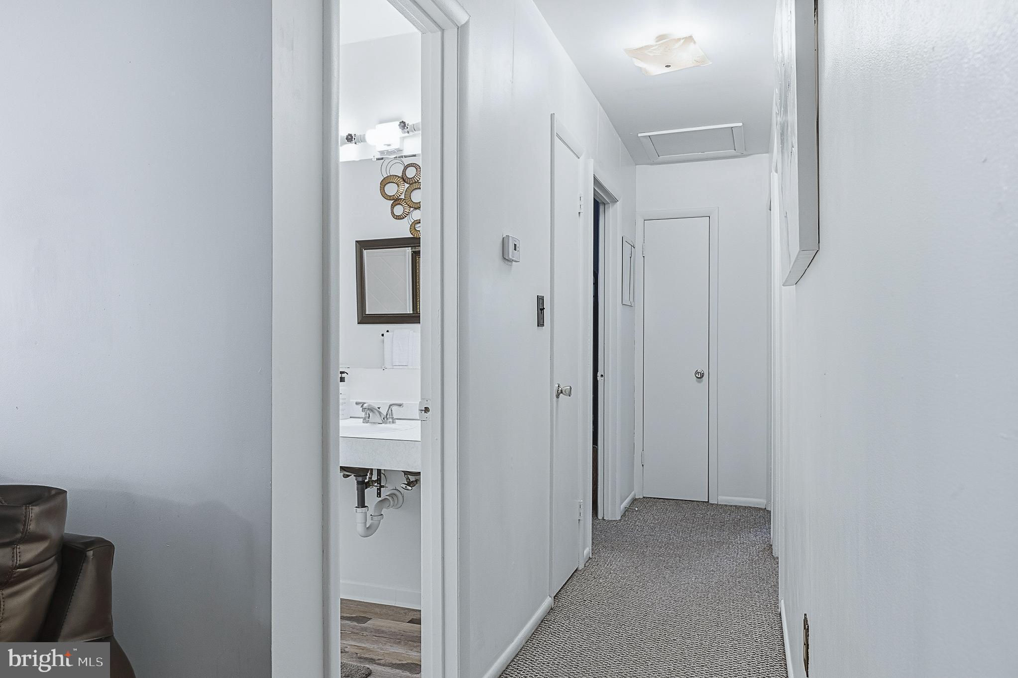 4542 Kinmount Road Lanham, MD 20706 - Photo 27 of 70 a view of a hallway with wooden floor