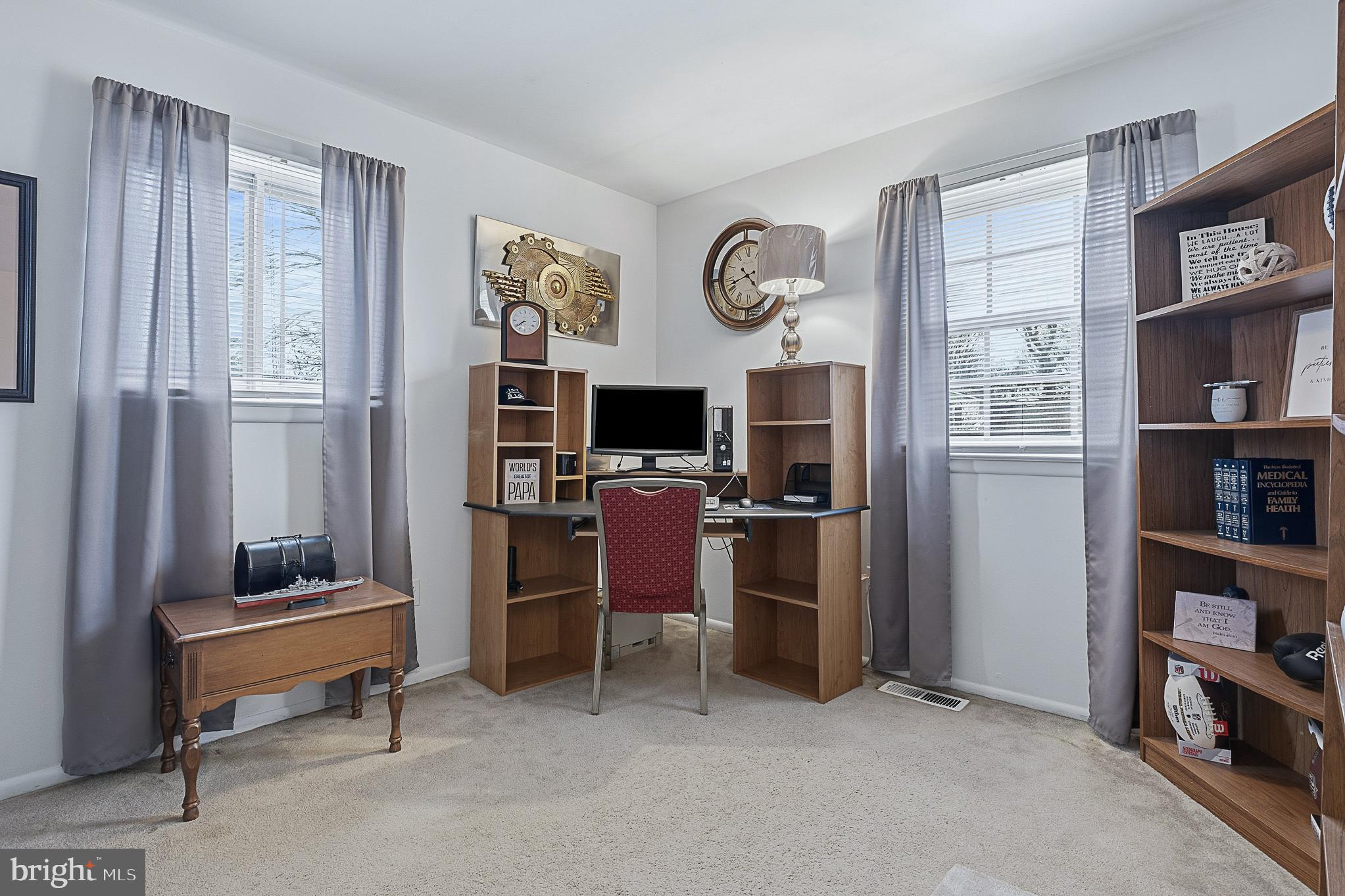4542 Kinmount Road Lanham, MD 20706 - Photo 33 of 70 a view of a workspace with furniture and a window