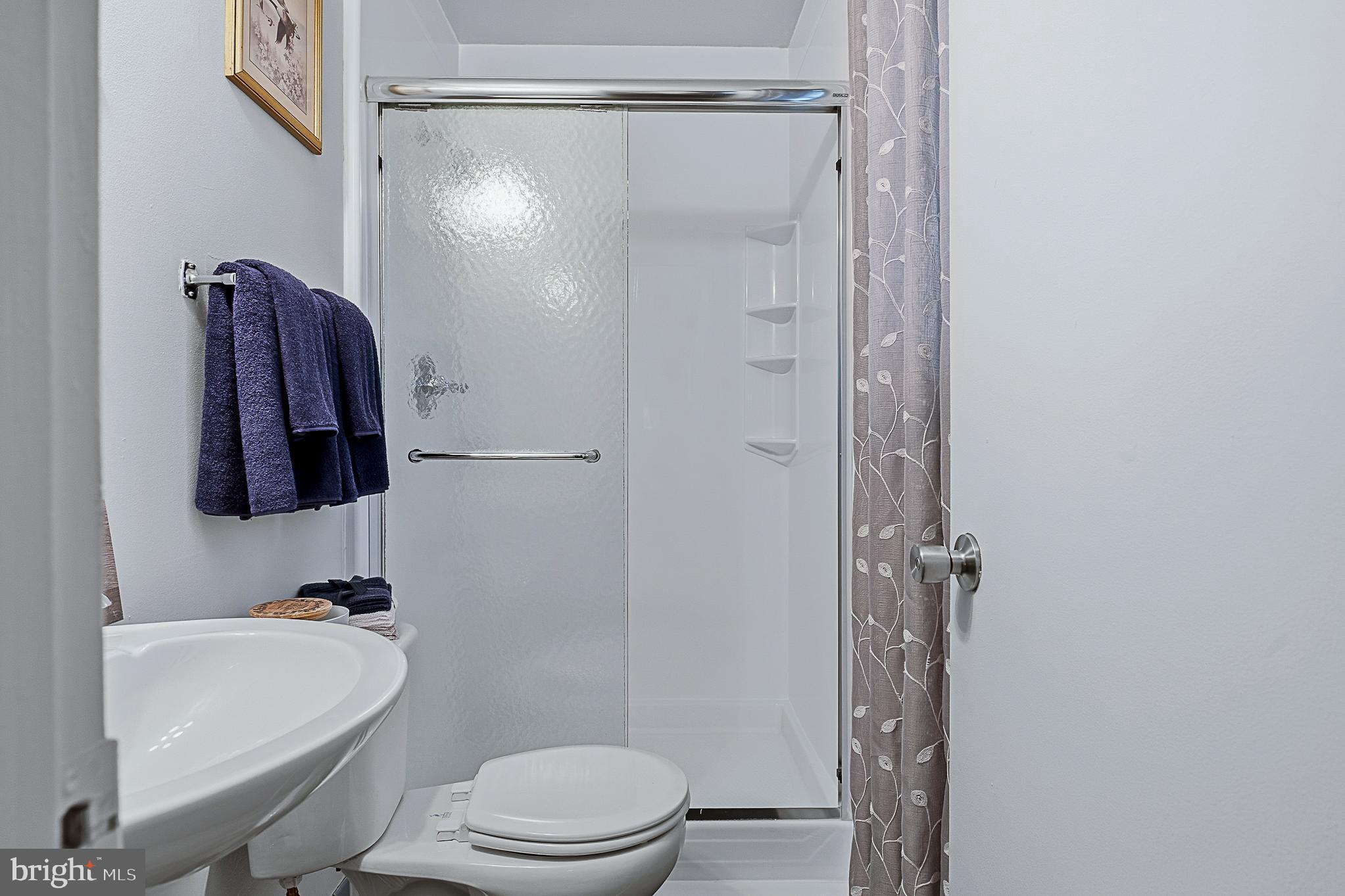 4542 Kinmount Road Lanham, MD 20706 - Photo 38 of 70 a bathroom with a toilet and a shower