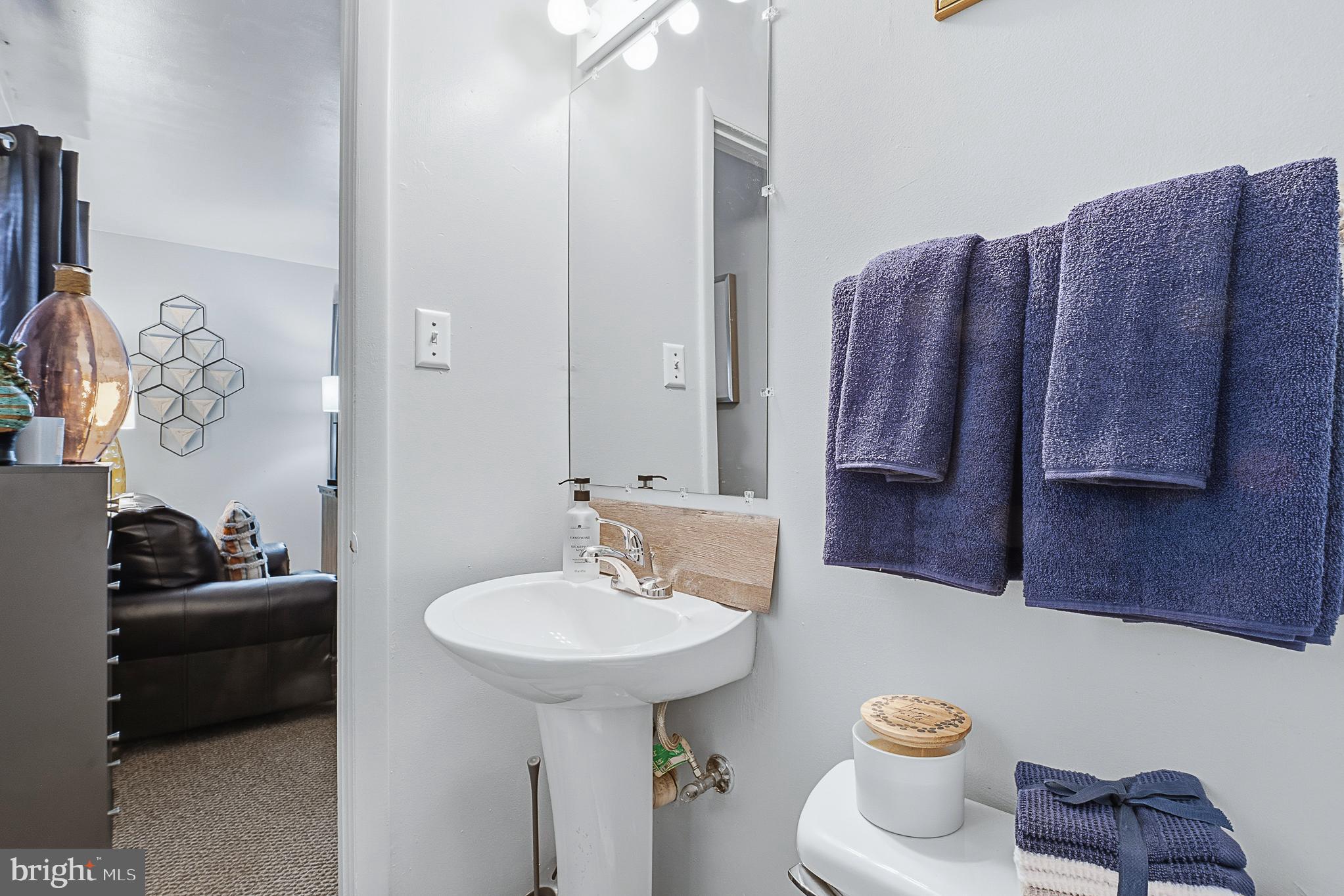 4542 Kinmount Road Lanham, MD 20706 - Photo 40 of 70 a bathroom with a sink toilet and mirror
