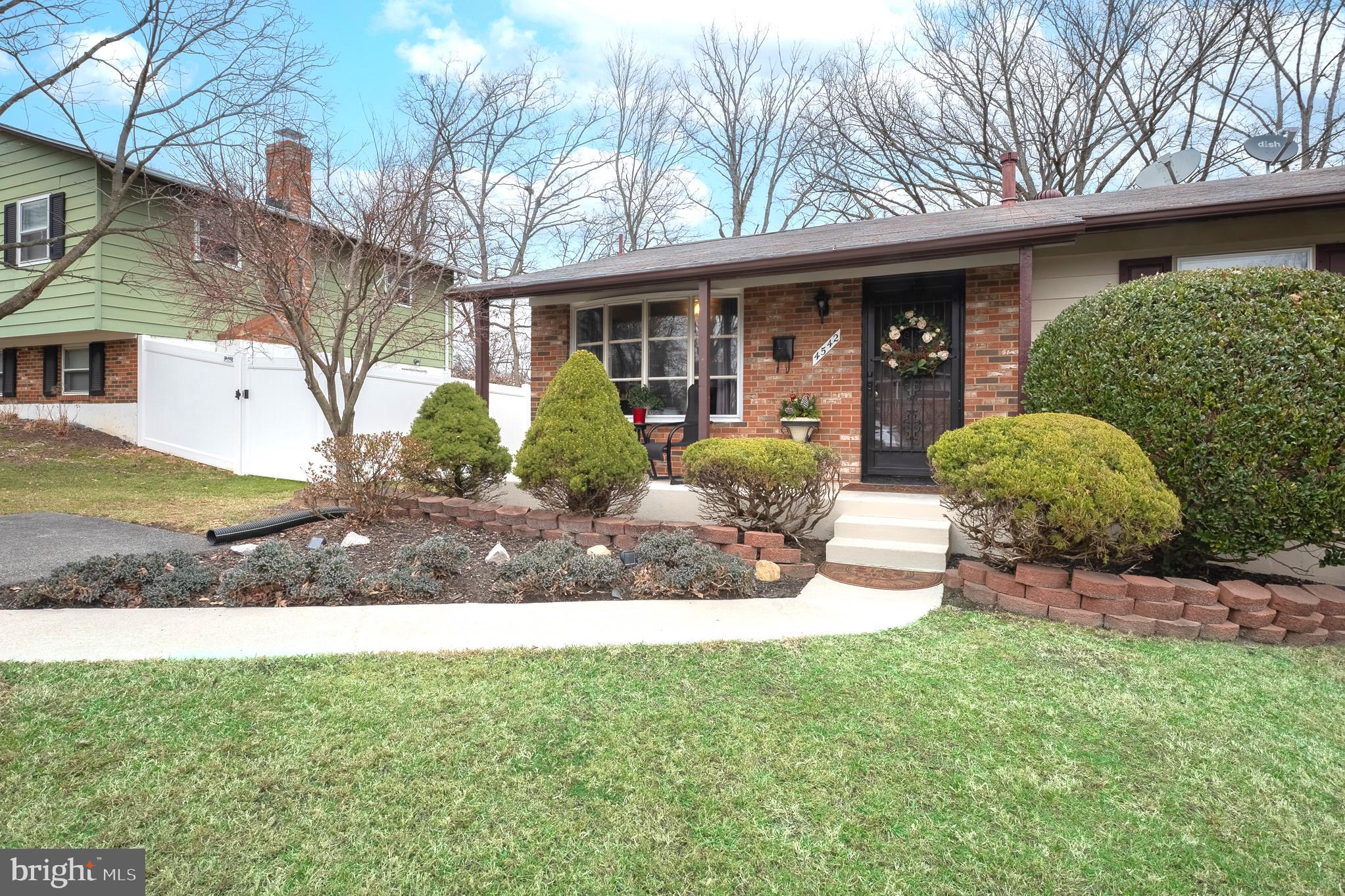 4542 Kinmount Road Lanham, MD 20706 - Photo 4 of 70 a front view of a house with garden and porch