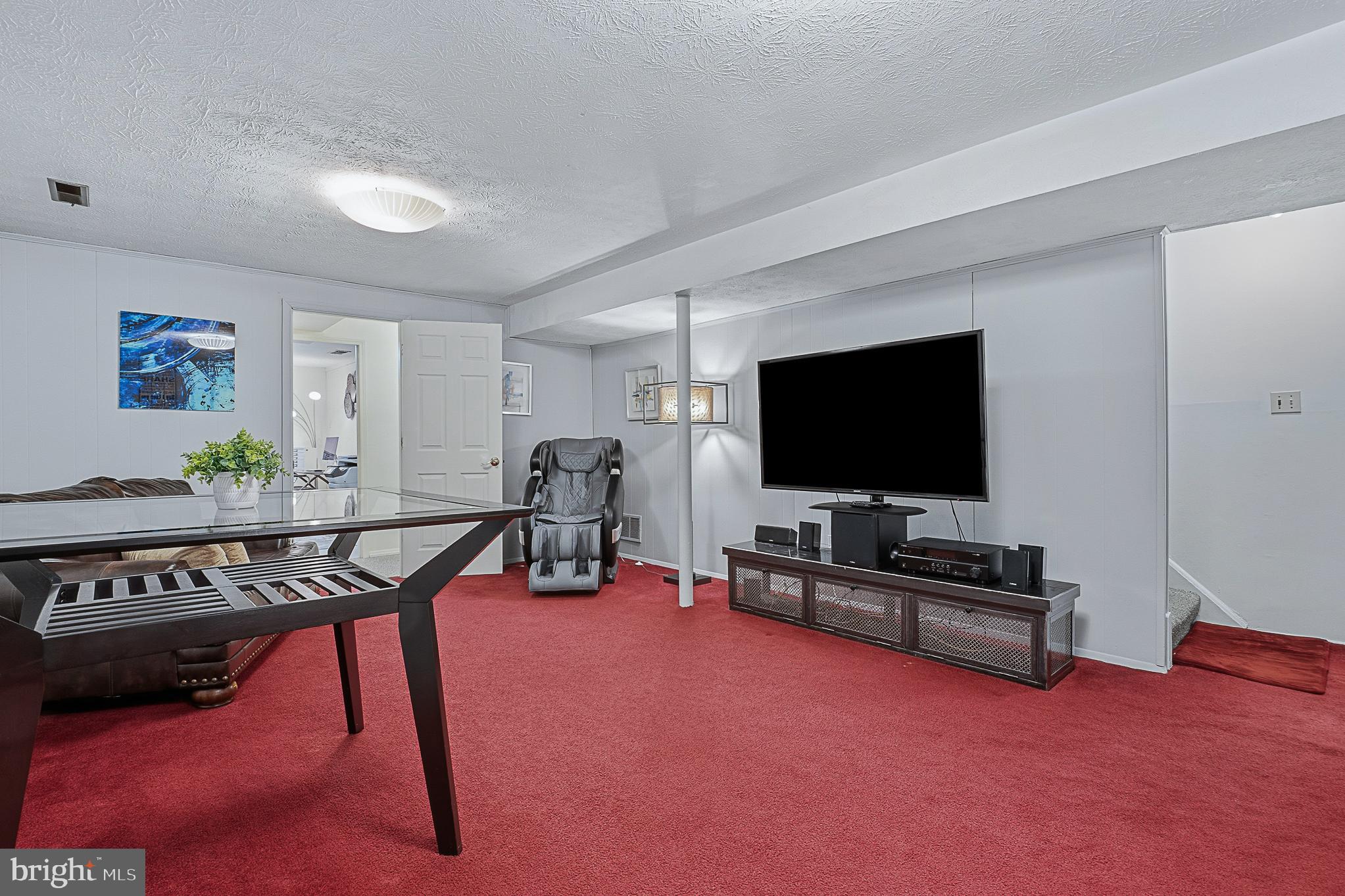 4542 Kinmount Road Lanham, MD 20706 - Photo 44 of 70 a living room with furniture and a flat screen tv