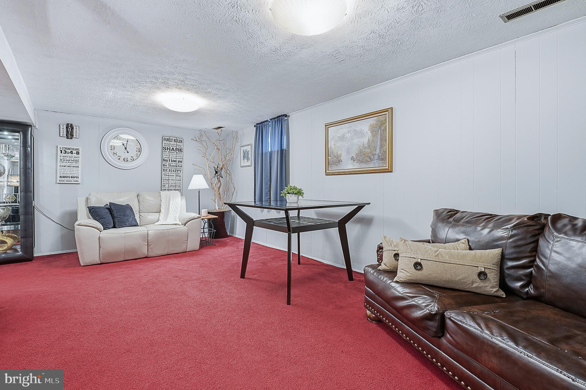 4542 Kinmount Road Lanham, MD 20706 - Photo 46 of 70 a living room with furniture and a table