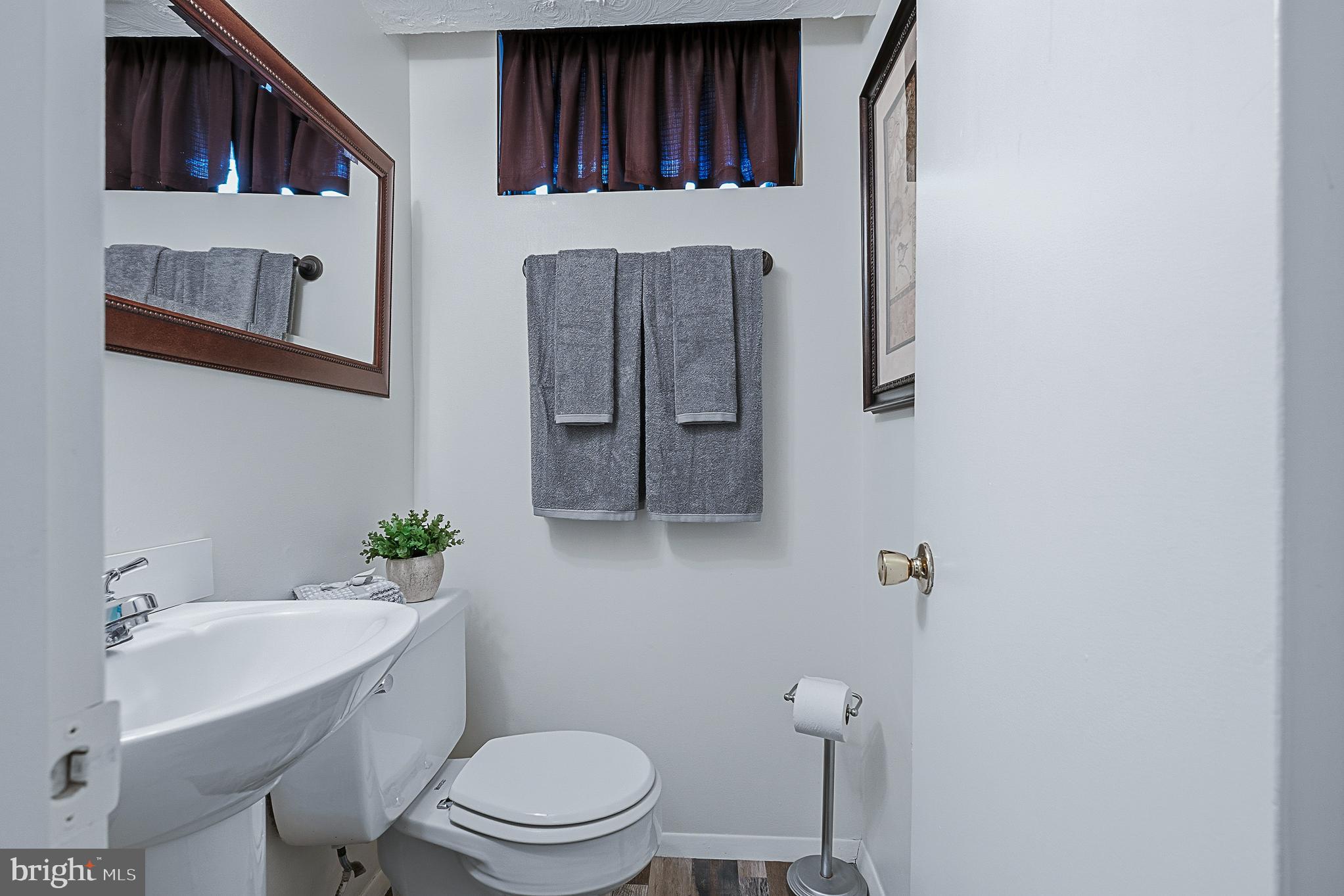 4542 Kinmount Road Lanham, MD 20706 - Photo 48 of 70 a bathroom with a sink toilet and shower