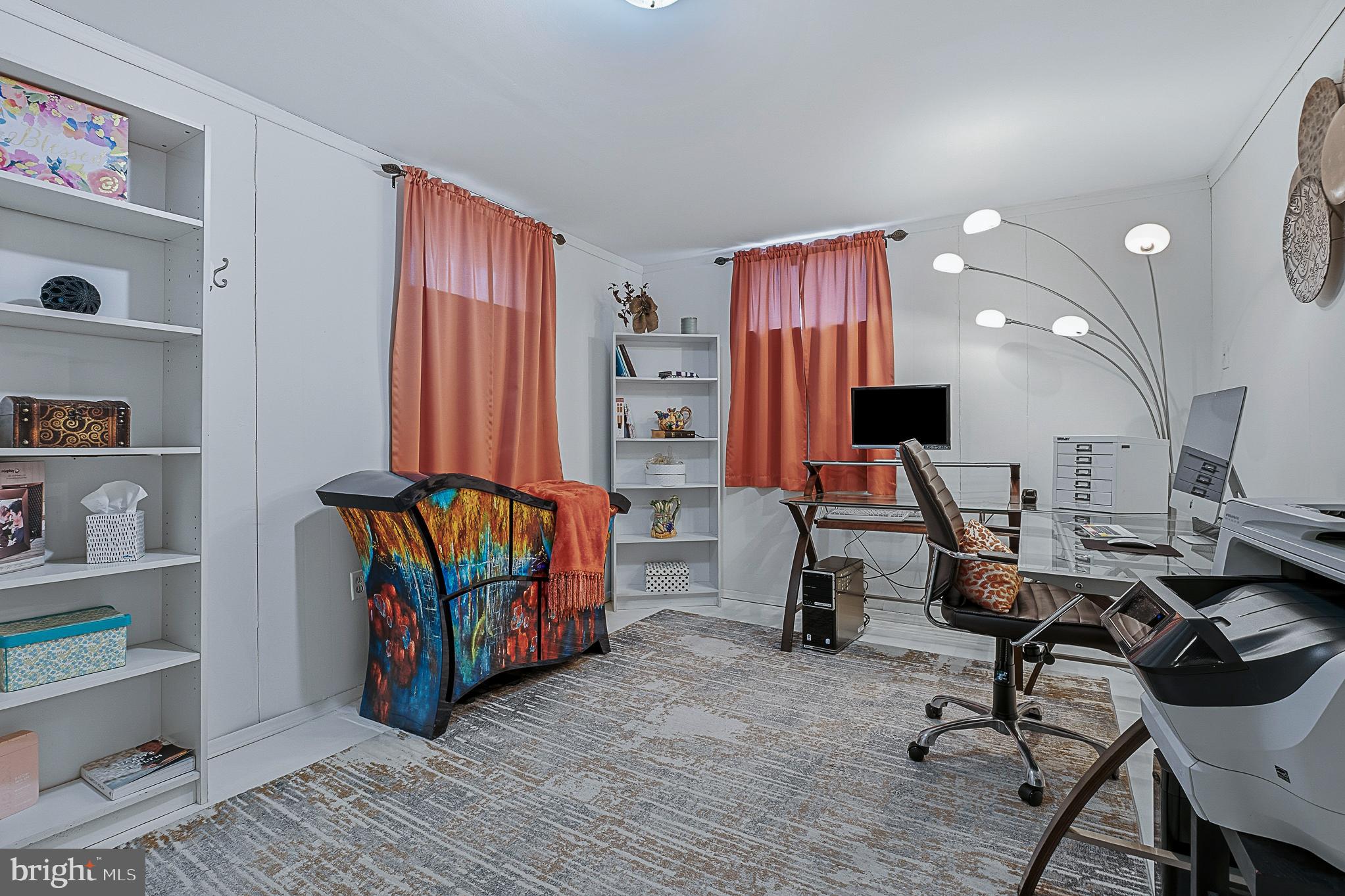 4542 Kinmount Road Lanham, MD 20706 - Photo 50 of 70 a view of a workspace with furniture and a window