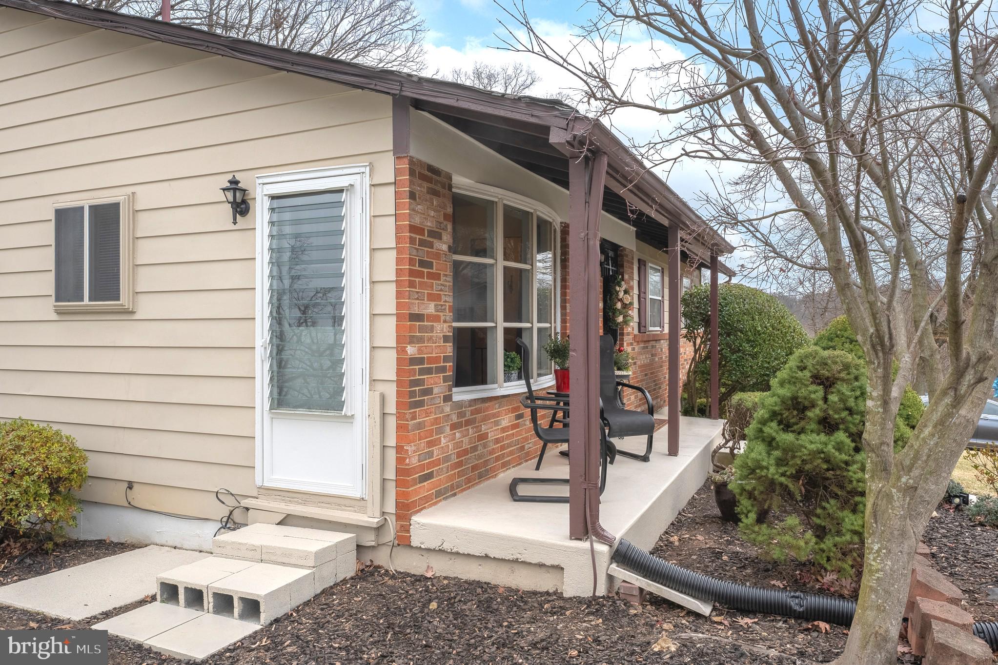 4542 Kinmount Road Lanham, MD 20706 - Photo 61 of 70 a front view of a house with garden