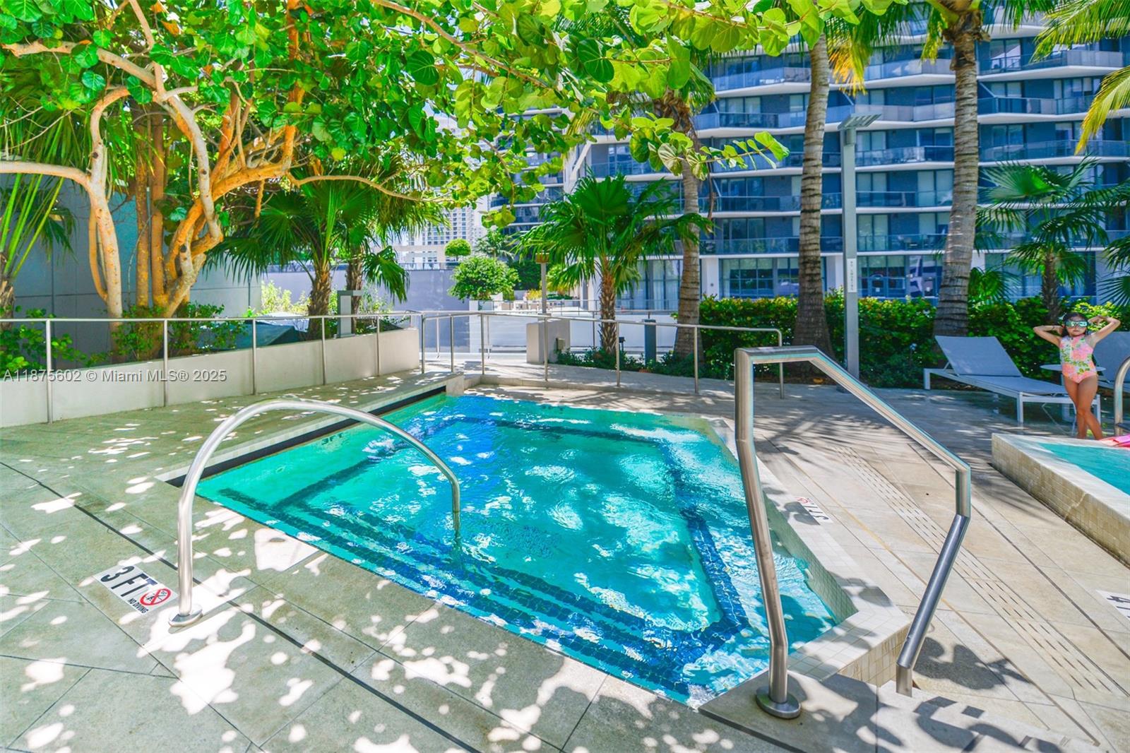 88 Southwest 7th Street, Unit 2204 Miami, FL 33130 - Photo 32 of 58 a view of a swimming pool with a patio