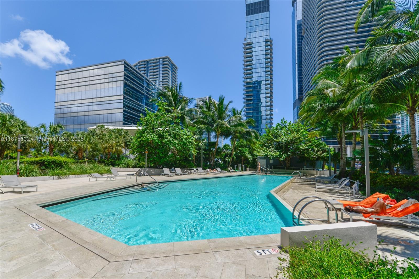 88 Southwest 7th Street, Unit 2204 Miami, FL 33130 - Photo 38 of 58 a view of a swimming pool with a lounge chair