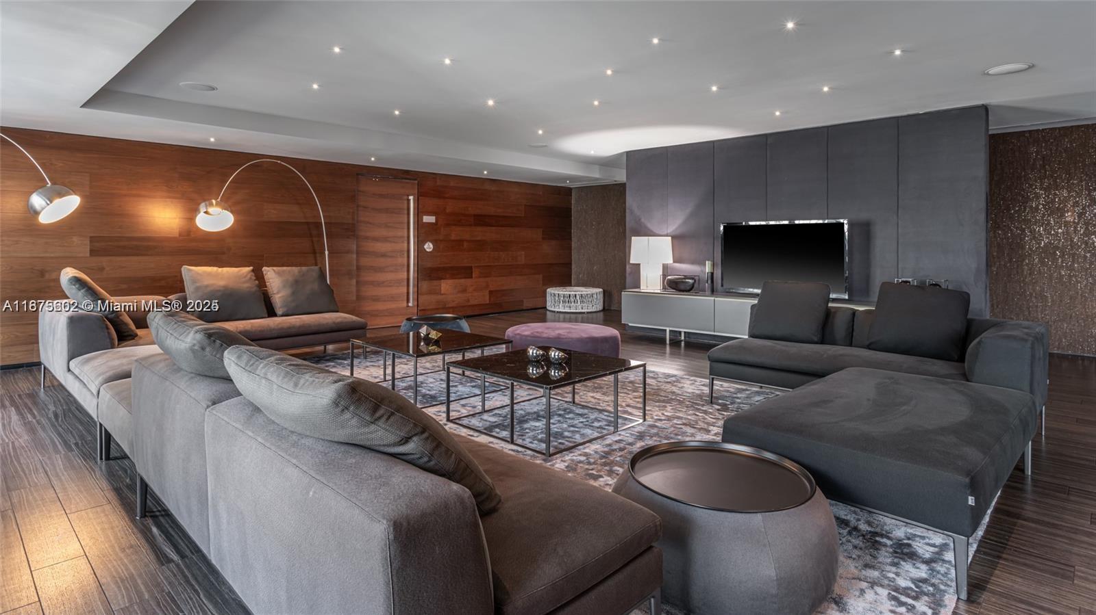 88 Southwest 7th Street, Unit 2204 Miami, FL 33130 - Photo 47 of 58 a living room with furniture and a flat screen tv