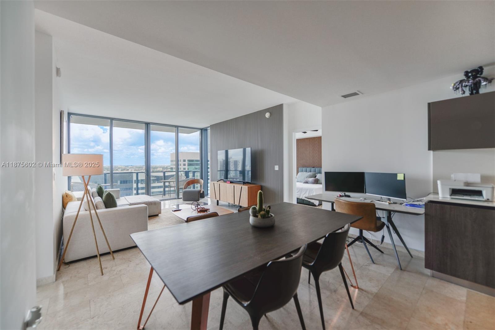 88 Southwest 7th Street, Unit 2204 Miami, FL 33130 - Photo 8 of 58 a view of a dining room with a table and chairs
