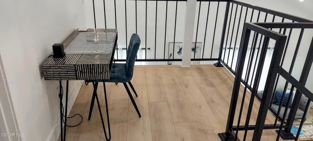 a view of staircase with white walls and a window