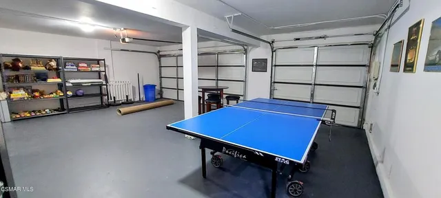 a living room with lots of furniture and clutter