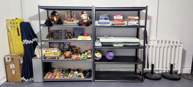 a view of an entryway with wooden floor and a livingroom