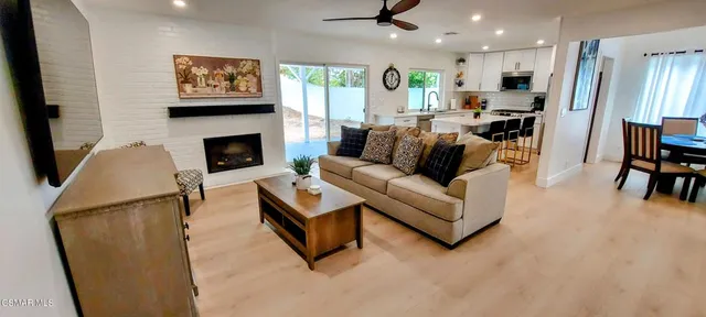 a living room with furniture and a fireplace
