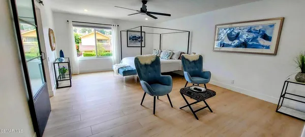a view of a livingroom with furniture and a window