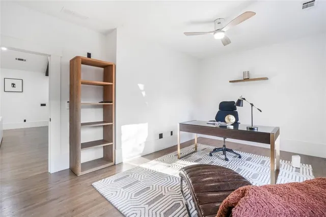 a bedroom with a bed and cabinets