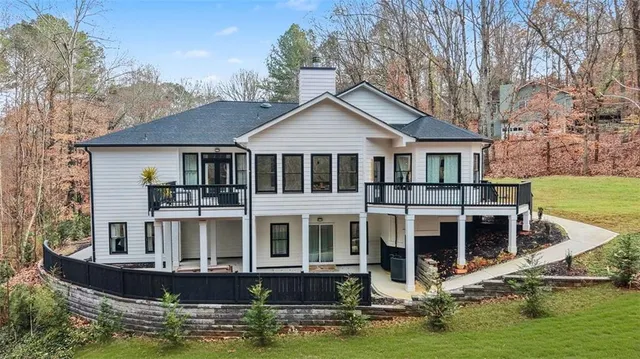 an aerial view of a house with roof deck front of house