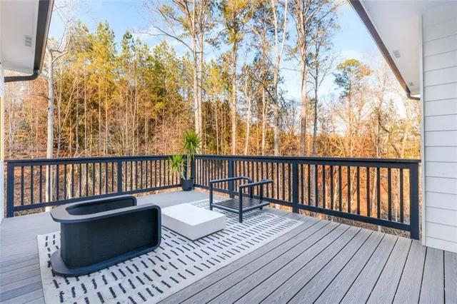 a large white kitchen with a sink a refrigerator and a stove top oven