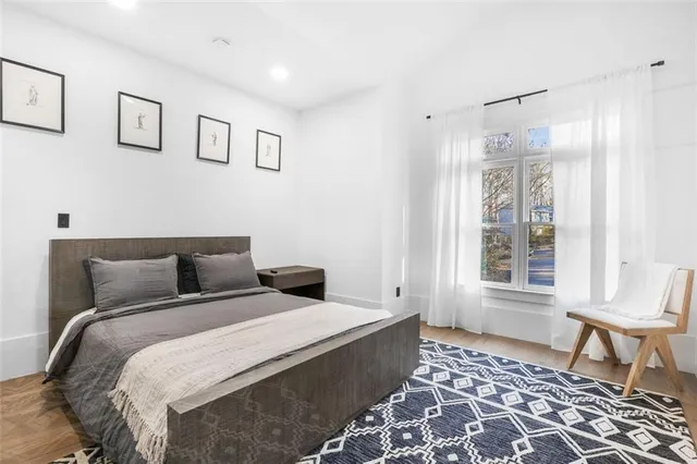 a living room with furniture and a mirror