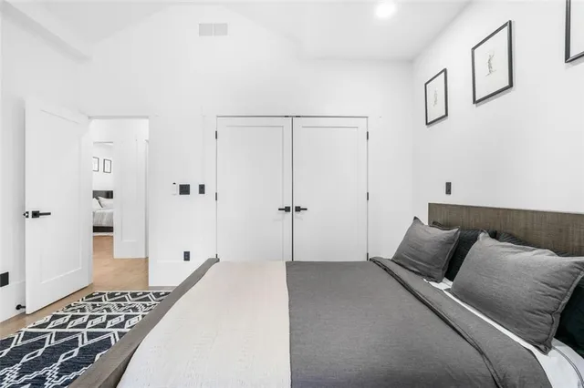 a living room with furniture a rug and a window