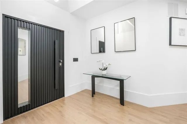 a kitchen with a fireplace and cabinets