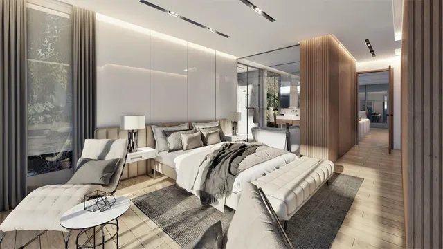 a room with a bed a mirror and windows