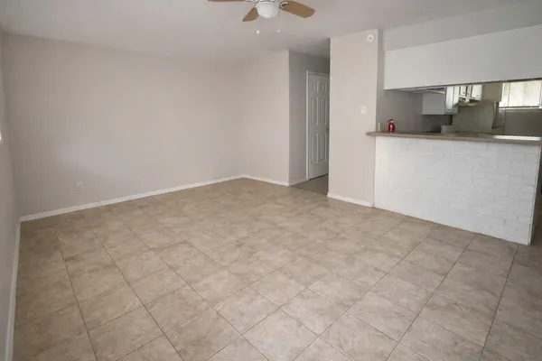 a kitchen with granite countertop a sink and a stove top oven