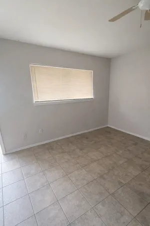 a view of an empty room with a window