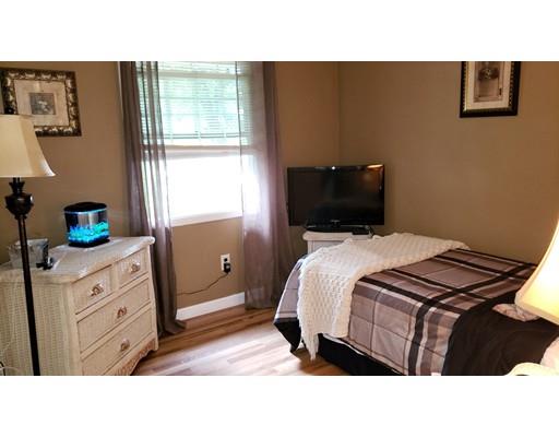 12 Parlee Road Chelmsford, MA 01824 - Photo 11 of 31 a bedroom with a bed and a potted plant