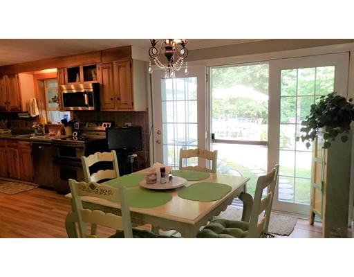 12 Parlee Road Chelmsford, MA 01824 - Photo 16 of 31 a kitchen with a table chairs and a dining table