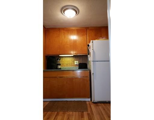 12 Parlee Road Chelmsford, MA 01824 - Photo 18 of 31 a kitchen with a refrigerator and a cabinets