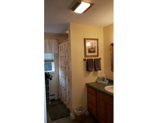 12 Parlee Road Chelmsford, MA 01824 - Photo 25 of 31 a bathroom with a sink a mirror and a toilet