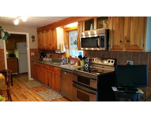 12 Parlee Road Chelmsford, MA 01824 - Photo 6 of 31 a kitchen with stainless steel appliances kitchen island granite countertop a sink dishwasher stove and cabinets