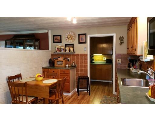12 Parlee Road Chelmsford, MA 01824 - Photo 7 of 31 a kitchen with a table and chairs