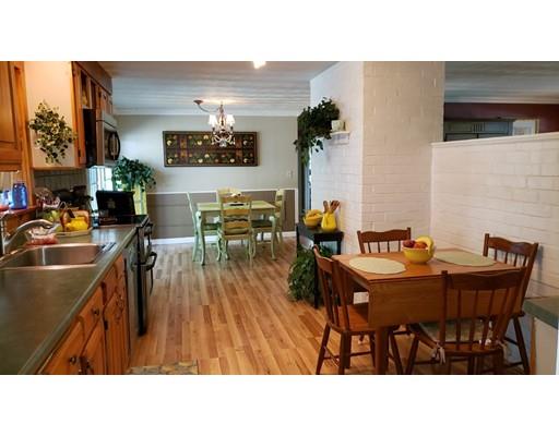 12 Parlee Road Chelmsford, MA 01824 - Photo 8 of 31 a kitchen with a table and chairs in it