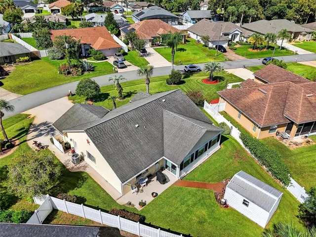 an aerial view of residential house with outdoor space and street view
