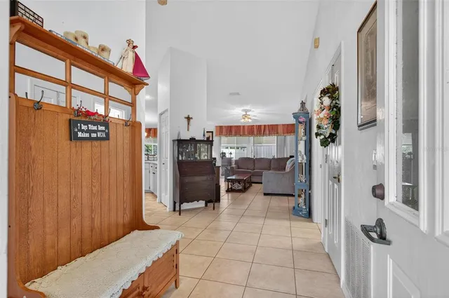 a room with furniture a rug and a window