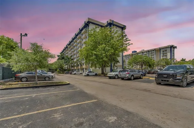 a view of a cars parked in front of a house