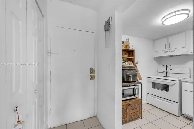 a kitchen with cabinets and appliances